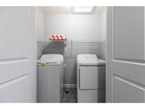 108 Ranchers View, Okotoks, AB - Indoor Photo Showing Laundry Room