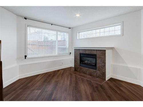 21-2040 35 Avenue Sw, Calgary, AB - Indoor Photo Showing Living Room With Fireplace