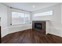 21-2040 35 Avenue Sw, Calgary, AB  - Indoor Photo Showing Living Room With Fireplace 