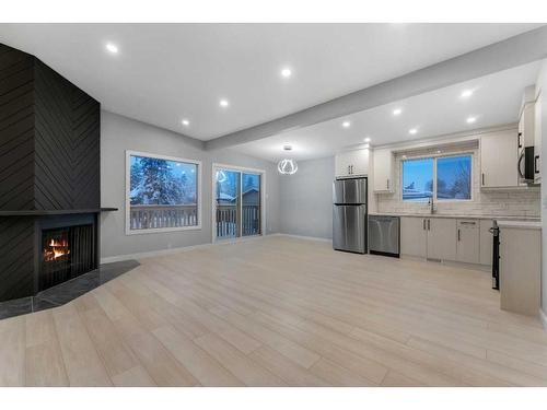 3443 35 Avenue Se, Calgary, AB - Indoor Photo Showing Kitchen With Fireplace