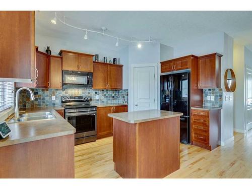 86 Cougartown Circle Sw, Calgary, AB - Indoor Photo Showing Kitchen With Double Sink