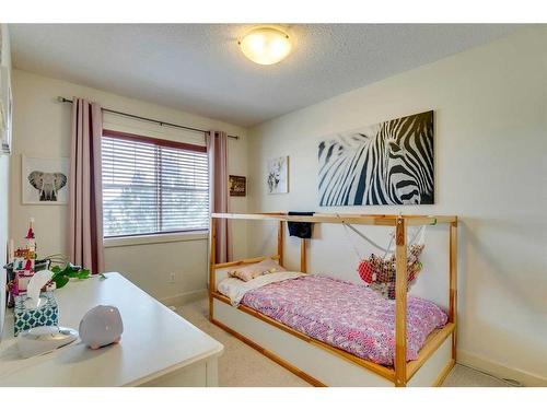 86 Cougartown Circle Sw, Calgary, AB - Indoor Photo Showing Bedroom