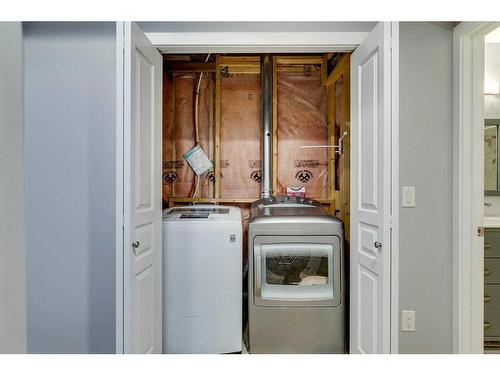 86 Cougartown Circle Sw, Calgary, AB - Indoor Photo Showing Laundry Room