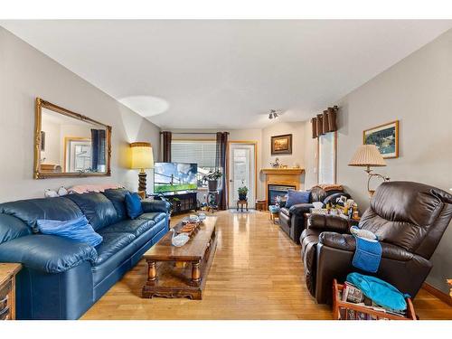 29-6009 62 Avenue, Olds, AB - Indoor Photo Showing Living Room With Fireplace