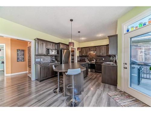 196 Sunset Circle, Cochrane, AB - Indoor Photo Showing Kitchen With Stainless Steel Kitchen