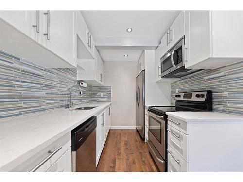 107-9930 Bonaventure Drive Se, Calgary, AB - Indoor Photo Showing Kitchen With Stainless Steel Kitchen With Upgraded Kitchen