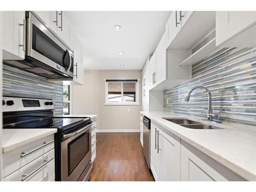 107-9930 Bonaventure Drive Se, Calgary, AB - Indoor Photo Showing Kitchen With Double Sink With Upgraded Kitchen