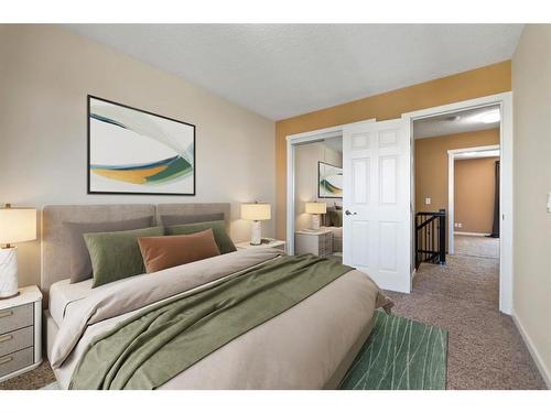 107-9930 Bonaventure Drive Se, Calgary, AB - Indoor Photo Showing Bedroom