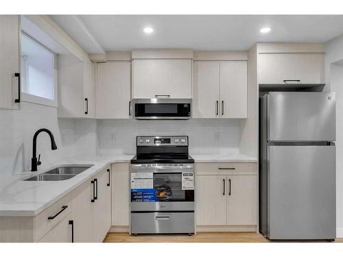 143 Bermuda Drive Nw, Calgary, AB - Indoor Photo Showing Kitchen With Double Sink