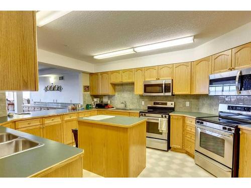 233-223 Tuscany Springs Boulevard Nw, Calgary, AB - Indoor Photo Showing Kitchen With Stainless Steel Kitchen With Double Sink