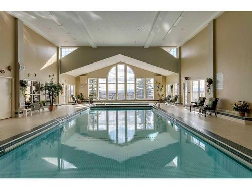 233-223 Tuscany Springs Boulevard Nw, Calgary, AB - Indoor Photo Showing Other Room With In Ground Pool