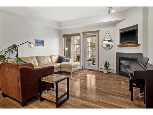 233-223 Tuscany Springs Boulevard Nw, Calgary, AB - Indoor Photo Showing Living Room With Fireplace