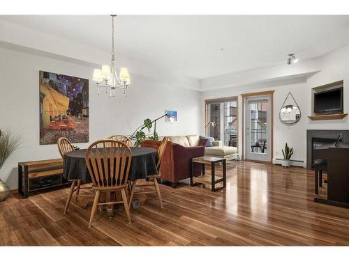 233-223 Tuscany Springs Boulevard Nw, Calgary, AB - Indoor Photo Showing Dining Room With Fireplace