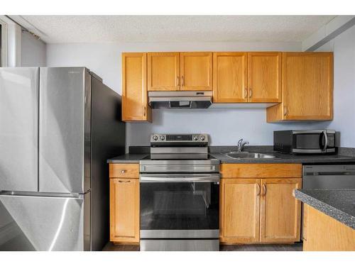 401-1236 15 Avenue Sw, Calgary, AB - Indoor Photo Showing Kitchen With Stainless Steel Kitchen