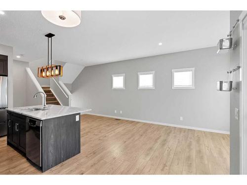 681-101 Sunset Drive, Cochrane, AB - Indoor Photo Showing Kitchen With Double Sink