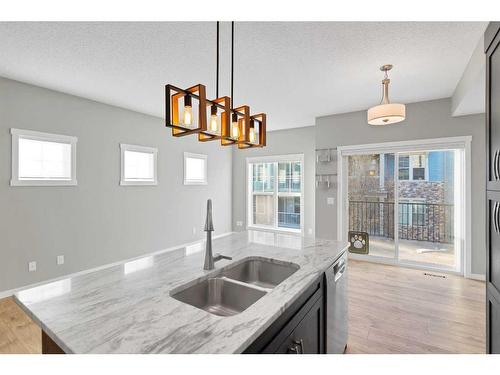 681-101 Sunset Drive, Cochrane, AB - Indoor Photo Showing Kitchen With Double Sink