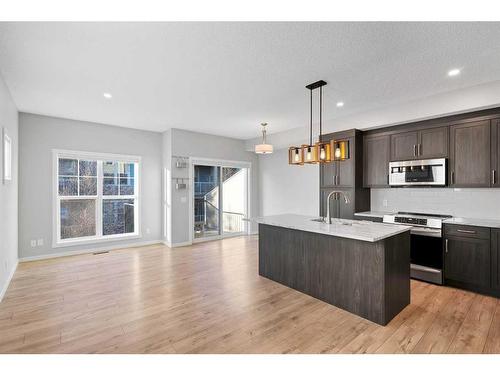 681-101 Sunset Drive, Cochrane, AB - Indoor Photo Showing Kitchen With Stainless Steel Kitchen With Upgraded Kitchen