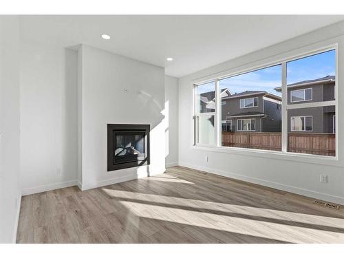 15 Sandpiper Bend, Chestermere, AB - Indoor Photo Showing Living Room With Fireplace