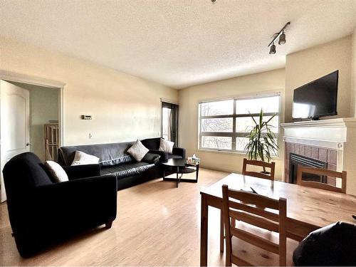 351-333 Riverfront Avenue Se, Calgary, AB - Indoor Photo Showing Living Room With Fireplace