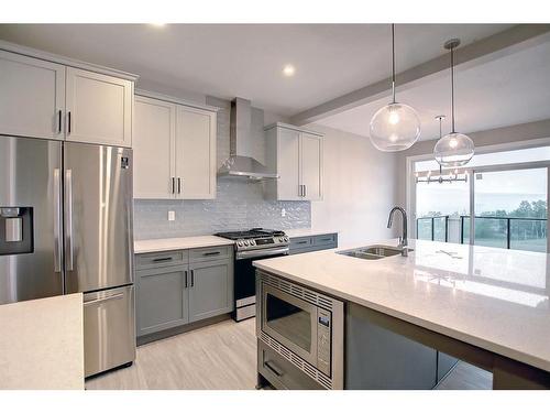 3 Precedence Green, Cochrane, AB - Indoor Photo Showing Kitchen With Double Sink With Upgraded Kitchen