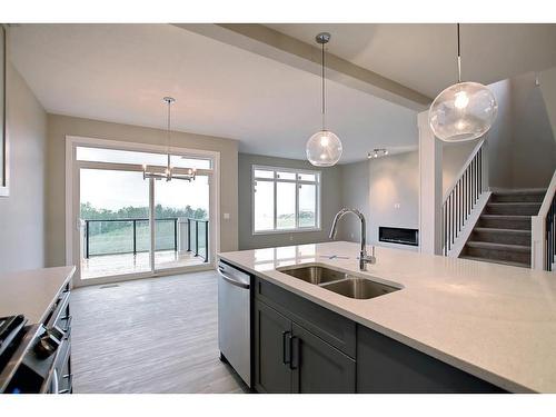 3 Precedence Green, Cochrane, AB - Indoor Photo Showing Kitchen With Double Sink