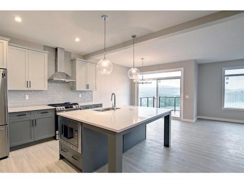 3 Precedence Green, Cochrane, AB - Indoor Photo Showing Kitchen With Double Sink With Upgraded Kitchen