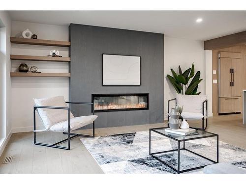 103 Lissington Drive Sw, Calgary, AB - Indoor Photo Showing Living Room With Fireplace