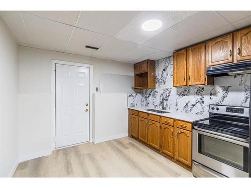 143 Erin Meadow Green Se, Calgary, AB - Indoor Photo Showing Kitchen With Double Sink