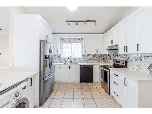 143 Erin Meadow Green Se, Calgary, AB - Indoor Photo Showing Kitchen With Stainless Steel Kitchen