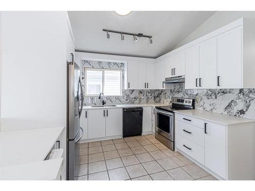 143 Erin Meadow Green Se, Calgary, AB - Indoor Photo Showing Kitchen With Stainless Steel Kitchen