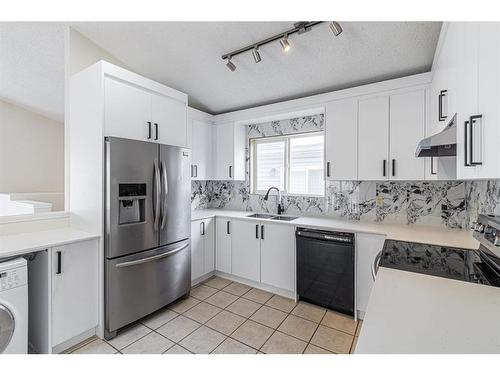 143 Erin Meadow Green Se, Calgary, AB - Indoor Photo Showing Kitchen With Stainless Steel Kitchen