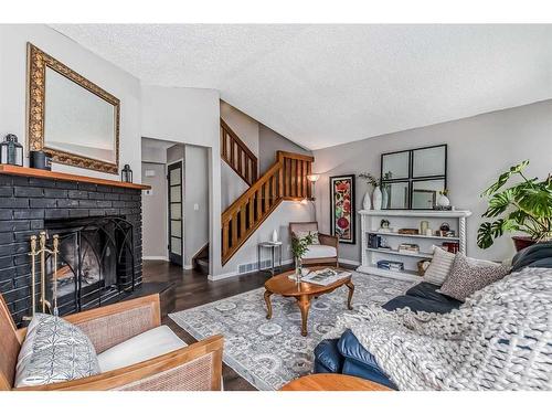 137 Woodfield Close Sw, Calgary, AB - Indoor Photo Showing Living Room With Fireplace