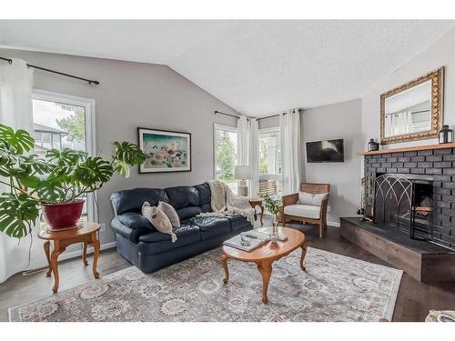 137 Woodfield Close Sw, Calgary, AB - Indoor Photo Showing Living Room With Fireplace