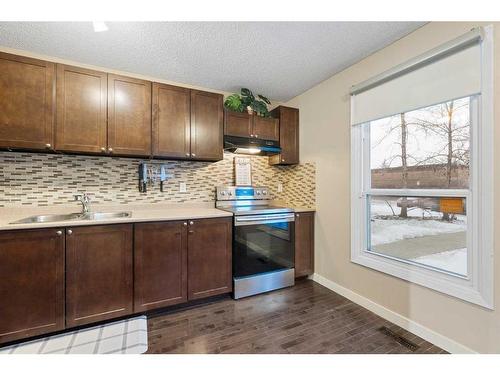 15-3200 60 Street Ne, Calgary, AB - Indoor Photo Showing Kitchen With Double Sink