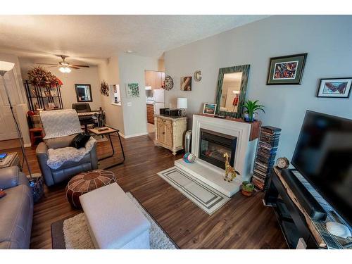 315-10120 Brookpark Boulevard Sw, Calgary, AB - Indoor Photo Showing Living Room With Fireplace