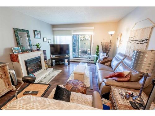 315-10120 Brookpark Boulevard Sw, Calgary, AB - Indoor Photo Showing Living Room With Fireplace