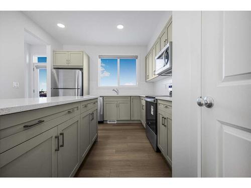 180 Belmont Way, Calgary, AB - Indoor Photo Showing Kitchen With Upgraded Kitchen