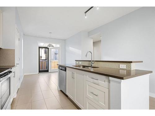 47 Sherwood Row Nw, Calgary, AB - Indoor Photo Showing Kitchen With Double Sink With Upgraded Kitchen