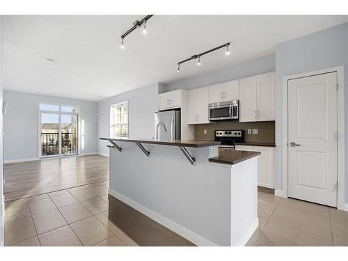 47 Sherwood Row Nw, Calgary, AB - Indoor Photo Showing Kitchen With Stainless Steel Kitchen