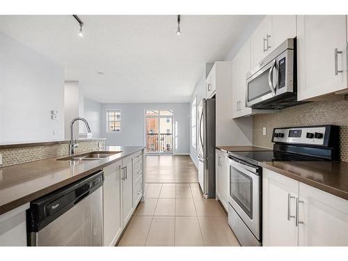 47 Sherwood Row Nw, Calgary, AB - Indoor Photo Showing Kitchen With Stainless Steel Kitchen With Double Sink With Upgraded Kitchen