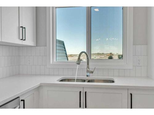 34 Lewiston Way, Calgary, AB - Indoor Photo Showing Kitchen With Double Sink