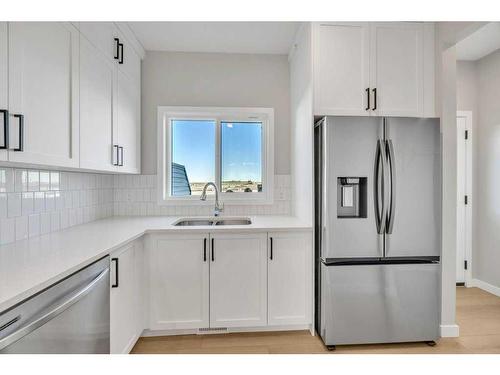 34 Lewiston Way, Calgary, AB - Indoor Photo Showing Kitchen With Double Sink