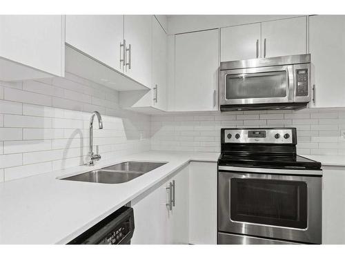 1103-302 Skyview Ranch Drive Ne, Calgary, AB - Indoor Photo Showing Kitchen With Stainless Steel Kitchen With Double Sink With Upgraded Kitchen