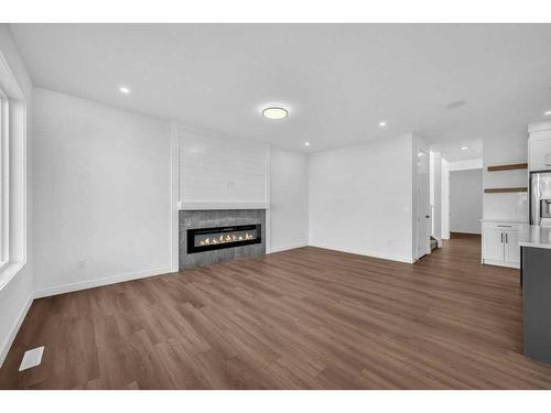 51 Heritage Circle, Cochrane, AB - Indoor Photo Showing Living Room With Fireplace