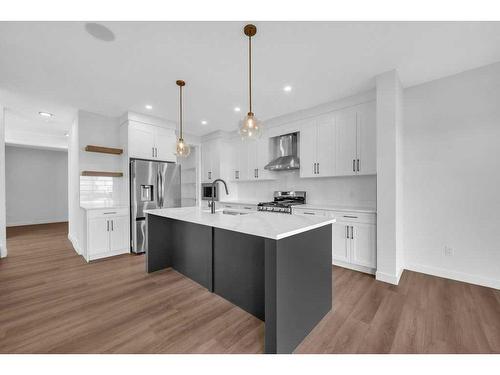 51 Heritage Circle, Cochrane, AB - Indoor Photo Showing Kitchen With Upgraded Kitchen