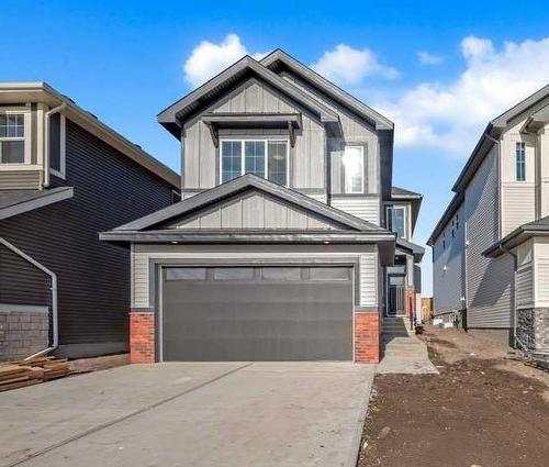 51 Heritage Circle, Cochrane, AB - Outdoor With Facade