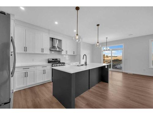 51 Heritage Circle, Cochrane, AB - Indoor Photo Showing Kitchen With Upgraded Kitchen