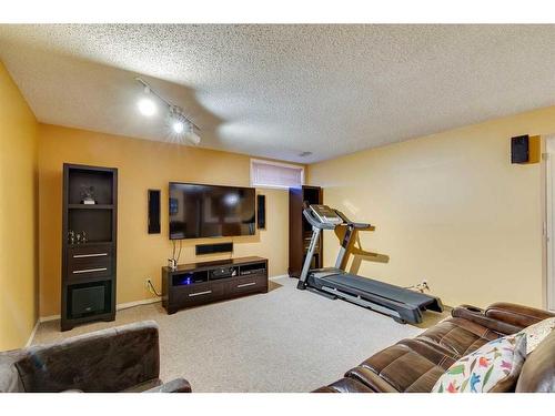 912 Shawnee Drive Sw, Calgary, AB - Indoor Photo Showing Gym Room