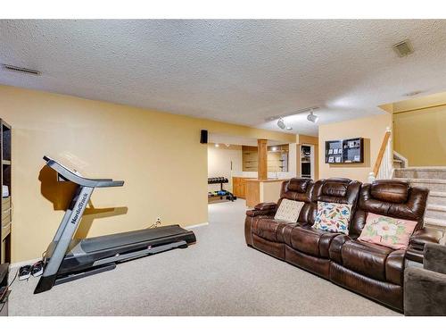 912 Shawnee Drive Sw, Calgary, AB - Indoor Photo Showing Gym Room