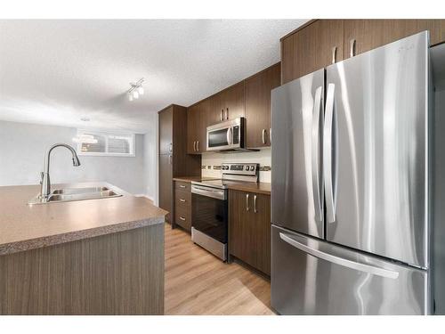 1415 Auburn Bay Circle Se, Calgary, AB - Indoor Photo Showing Kitchen With Double Sink